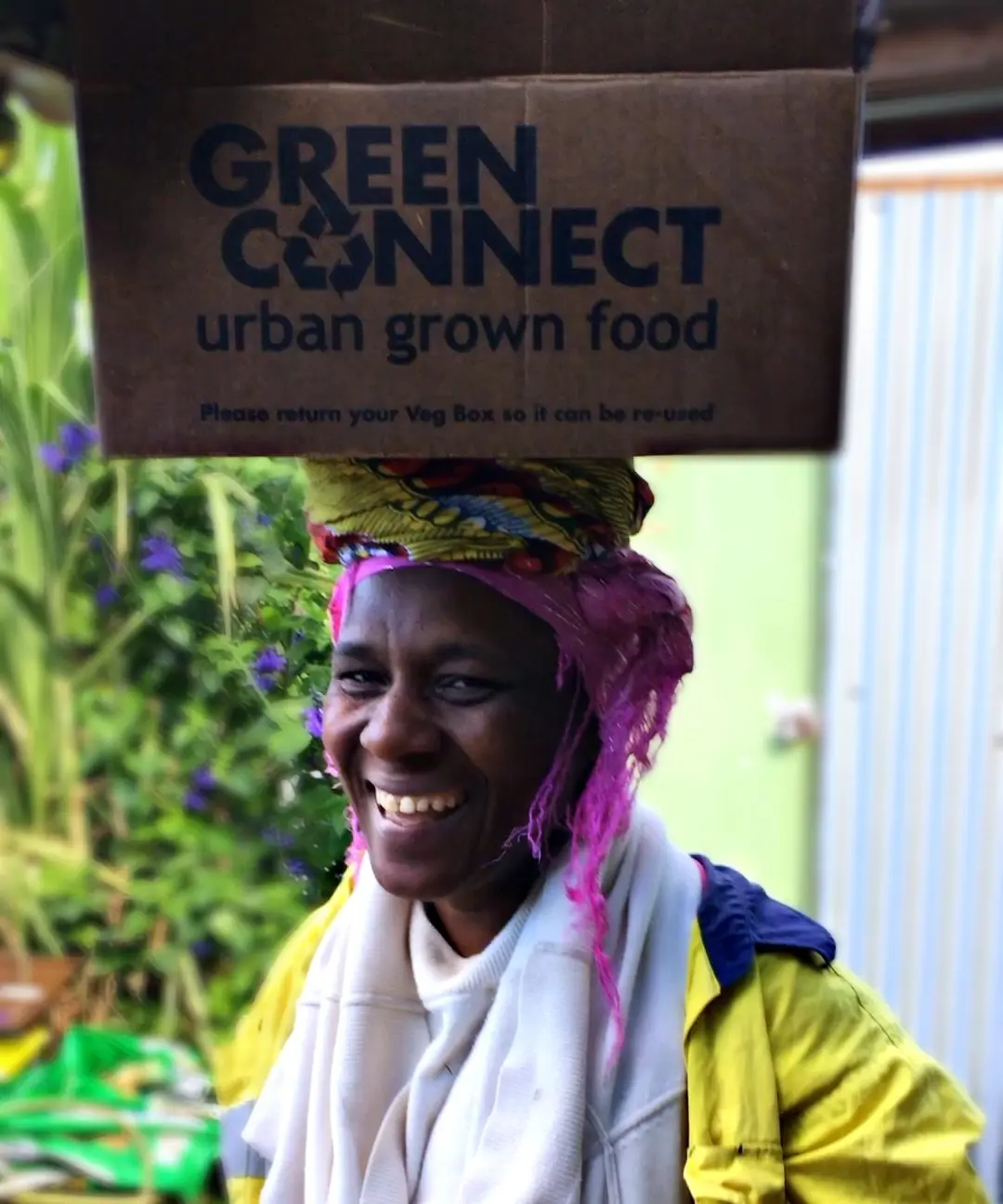 20190508_024723857_iOS Ama with veg box on her head