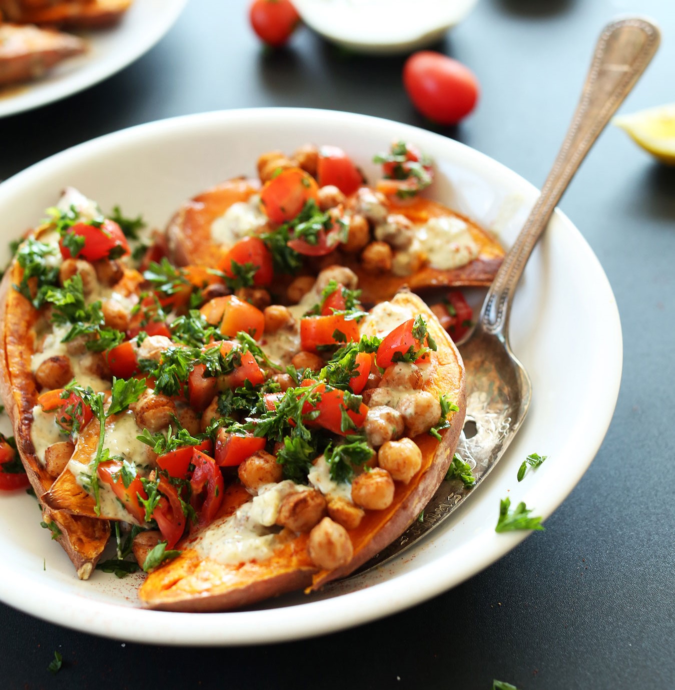 roasted sweet potatoes with chickpea, tomato, parsley topping