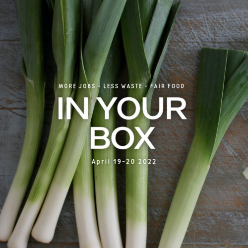 Cover photo with 'In Your Box', '19-20 April 2022' written in the center and leeks on cutting board in background