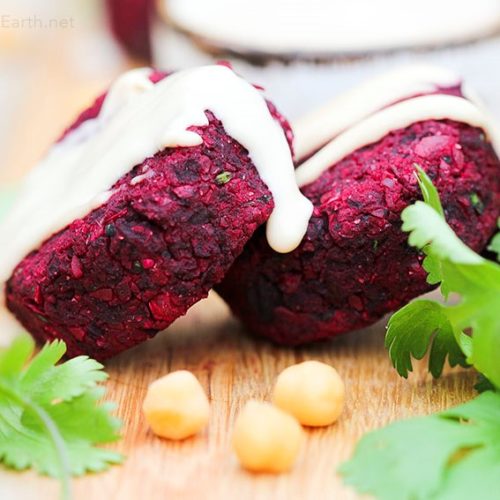 Beetroot falafel with tahini sauce drizzled on top